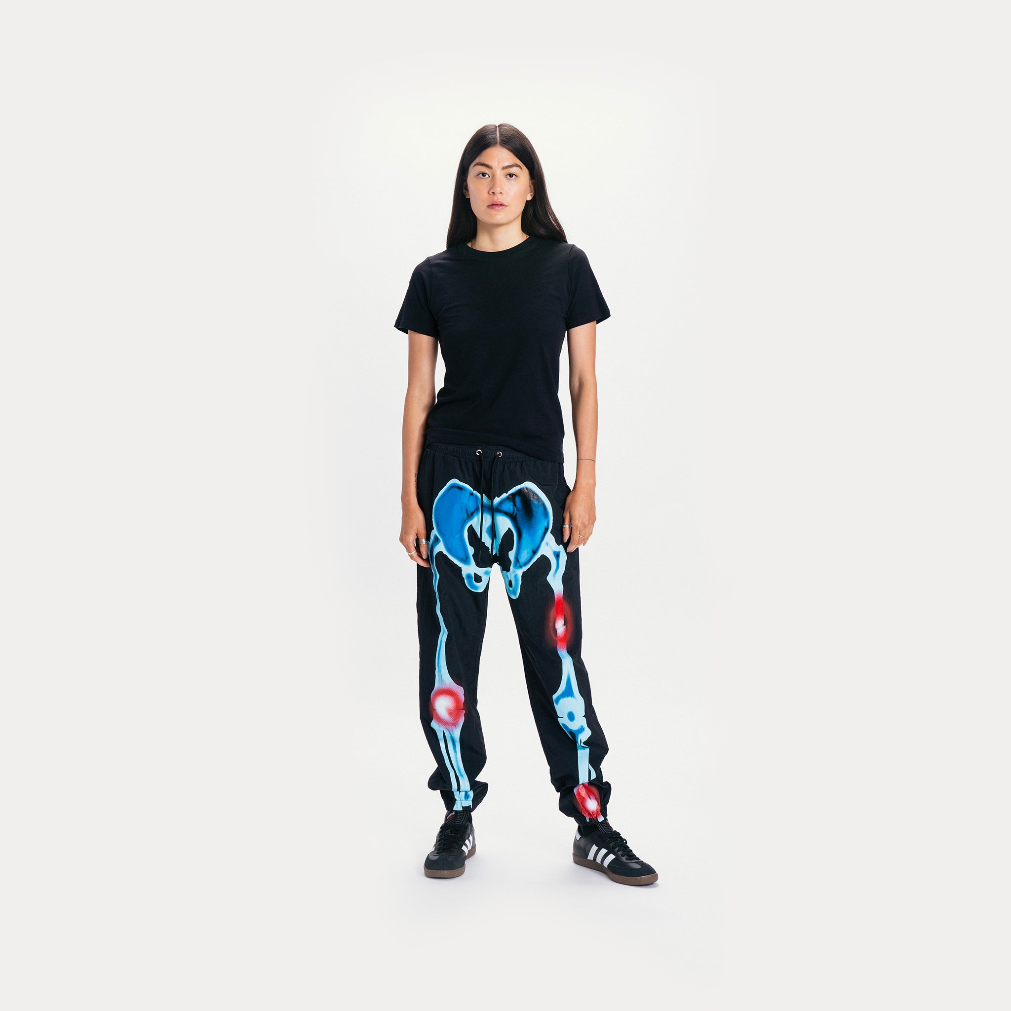 MARKET clothing brand INJURIES TRACK PANTS. Find more graphic tees, sweatpants, shorts and more bottoms at MarketStudios.com. Formally Chinatown Market. 