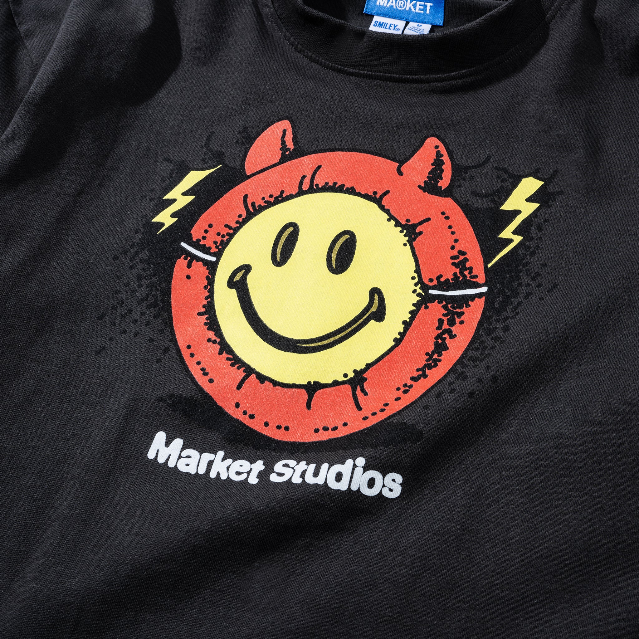 MARKET clothing brand SMILEY MASKED T-SHIRT. Find more graphic tees, hats, hoodies and more at MarketStudios.com. Formally Chinatown Market.